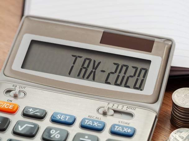 Up close of a calculator reading "tax-2020"