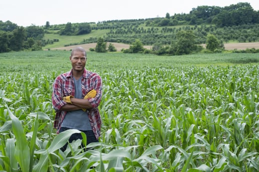 Rural landowner standing in his field